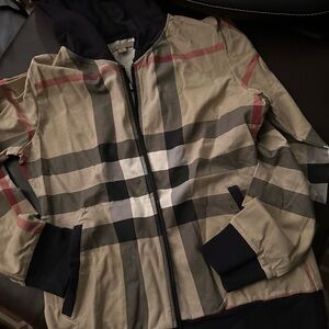 Fits like a small Burberry Beige and Black Checkered Jacket